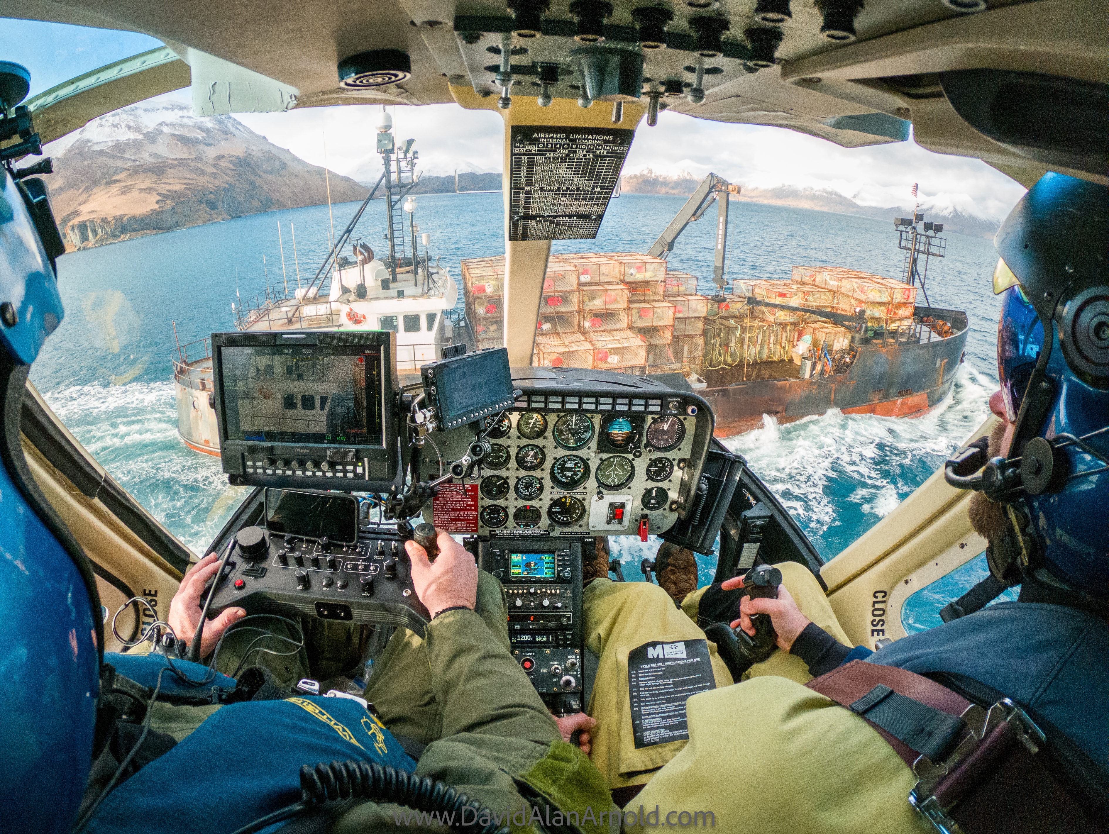 POV from helicopter cockpit chasing a crab boat loaded with pots through Alaskan waters, Deadliest Catch