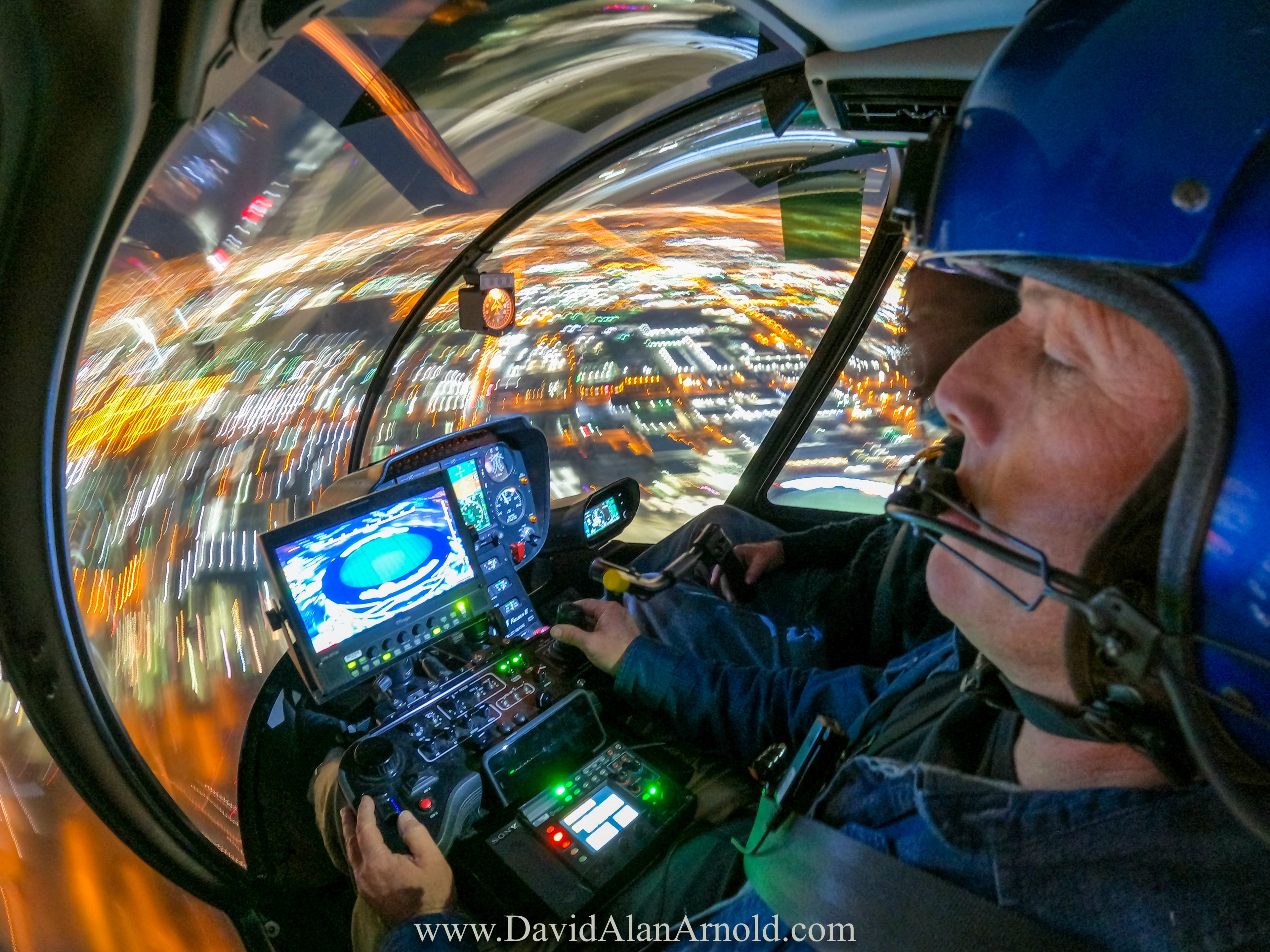 Wide-angle fisheye cockpit shot with Las Vegas Strip light trails streaking through the bubble window, Monday Night Football Las Vegas Raiders